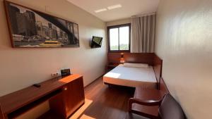 a small room with a bed and a desk at B&B HOTEL Tarragona Reus in Reus +13 photos