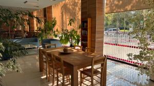 a dining room with a table and some plants at B&B HOTEL Tarragona Reus in Reus