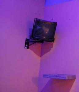 TV a/nebo společenská místnost v ubytování OYO Hotel Oasis