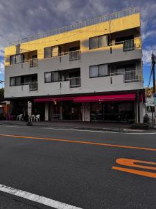 a building on the side of a street at 田 Den Kamakura Pet-friendly accommodation in Kamakura
