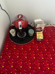 a table with a red table cloth with stars on it at Home No 7 