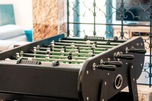 a black pool table with a green at Mas Sureda Soccer field & indooroutdoor pools in Argelès-sur-Mer +44 photos