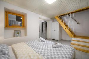 a bedroom with a bed with towels on it at Kuća za odmor Miha in Tar +19 photos