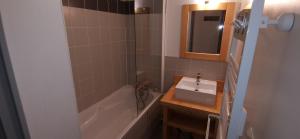 a bathroom with a sink and a bath tub at J de Balnea E N02 - 2P6 in Loudenvielle