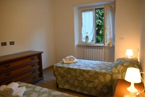 Ένα ή περισσότερα κρεβάτια σε δωμάτιο στο Casa dolce Casa