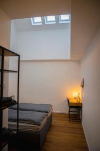 Postel nebo postele na pokoji v ubytování BM Rooms Innenstadt - Moderne City Zimmer mit eigenem Bad im Herzen der Innenstadt