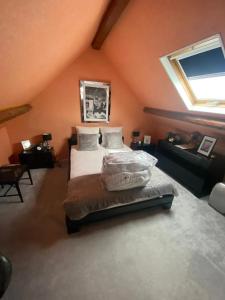 a bedroom with a bed in a room with a window at Maison spacieuse avec jardin à Cabourg, 250 m² in Cabourg