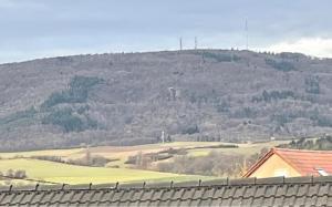 a view of a mountain with a fence in the foreground at Panoramablick Donnersberg in Dannenfels