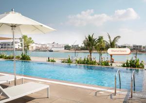 an image of a swimming pool at a resort at Oasis Homes by Olala Homes in Ras al Khaimah