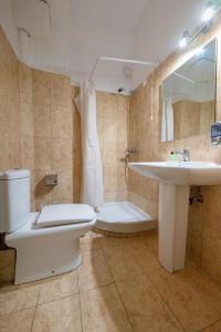 a bathroom with a toilet and a sink at Ulrika in Aegina Town