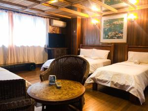 Ένα ή περισσότερα κρεβάτια σε δωμάτιο στο I vilainn Bukit Bintang