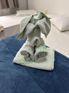 Ένα ή περισσότερα κρεβάτια σε δωμάτιο στο Alzira Plaza Hotel