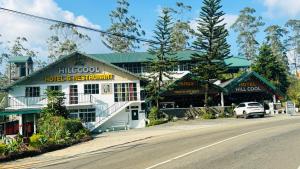 a building on the side of a road at Hill Cool Hotel & Restaurant in Hatton