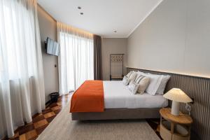 Postel nebo postele na pokoji v ubytování GuestReady - Gaveto de Lisboa GuestHouse + 12 fotografií