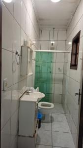 a small bathroom with a sink and a toilet at Hotel vitoria in Pedreira
