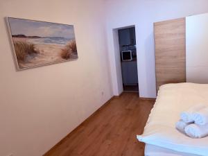 En eller flere senge i et værelse på Noe Apartment