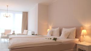 Postel nebo postele na pokoji v ubytování Hotel Brenner