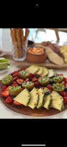 a plate of fruit and vegetables on a table at Soulful healing academy in Point Cook