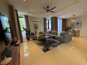 a living room with a couch and a table at The Mangrove at Carey Circles 