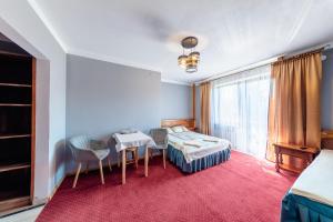 Postel nebo postele na pokoji v ubytování Dom Wypoczynkowy Podhalanka + 40 fotografií