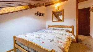 a bedroom with a bed in a room at Le Refuge du Forchat in Bellevaux