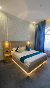 Postel nebo postele na pokoji v ubytování Hotel Turkistan Restaurants + 10 fotografií