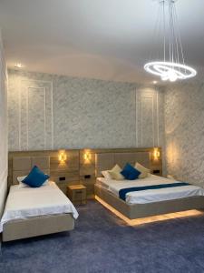Postel nebo postele na pokoji v ubytování Hotel Turkistan Restaurants