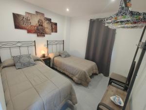 Postel nebo postele na pokoji v ubytování Casa Kalma