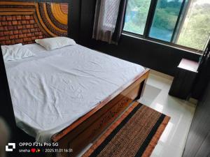 Postel nebo postele na pokoji v ubytování hotel daksh