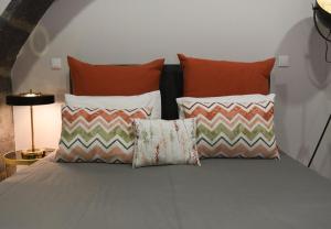 Ένα ή περισσότερα κρεβάτια σε δωμάτιο στο GuestReady - Casa das Arcadas