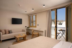 TV a/nebo společenská místnost v ubytování Portiani Suites