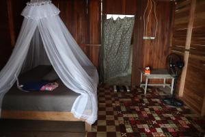 Postel nebo postele na pokoji v ubytování Saukabu Homestay