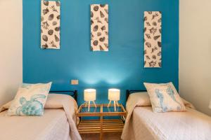 Ένα ή περισσότερα κρεβάτια σε δωμάτιο στο 600m from the beach - Garden and Sea View