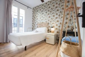 Ένα ή περισσότερα κρεβάτια σε δωμάτιο στο Kaixo Rooms