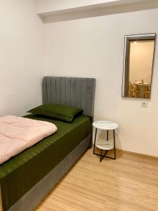 Postel nebo postele na pokoji v ubytování Skyhouse bsd tower duxton 2