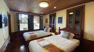 Postel nebo postele na pokoji v ubytování RainForest Guest Lodge