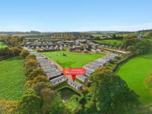 an aerial view of a group ofartmentsartmentschwitzchwitzchwitzchwitzchwitzchwitzchwitz at Greendale Splash Escape - No Commercial Sign written Vehicles,Fishing Nearby & Communal Swimming Pool Open April to September in Tedburn Saint Mary