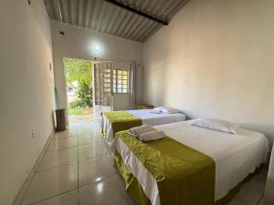 Ένα ή περισσότερα κρεβάτια σε δωμάτιο στο Caminito Brasília Hostel