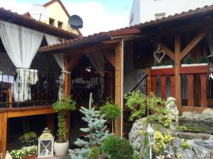 a house with a balcony with plants on it at U Krba in Nitra