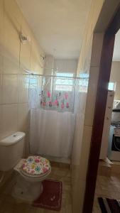 a bathroom with a toilet and a shower curtain at Hostel Tavares Bastos in Rio de Janeiro +50 photos