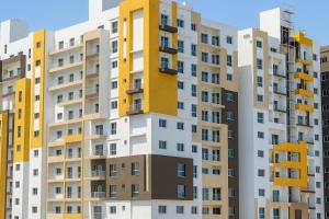an image of an apartment building with yellow and white at Résidence Luxe Dakar Centre Ville in Dakar