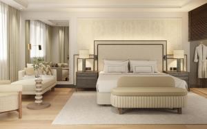 ein Schlafzimmer mit Bett und ein Wohnzimmer in der Unterkunft Hacienda del Mar member of Meliá Collection in Estepona