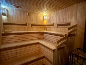 a sauna with a staircase in the middle of it at Casa Cedru in Ialoveni