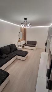 Χώρος καθιστικού στο Pilsētas sirds apartamenti