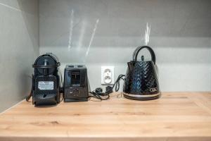 a group of items sitting on a wooden shelf at Apartly - City Home &B in Szczecin