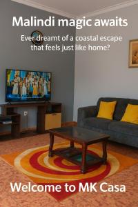 a living room with a couch and a coffee table at MK Casa Modern 3BR Retreat Fully Furnished in Malindi