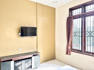 TV a/nebo společenská místnost v ubytování OYO 94897 Hotel Palapa