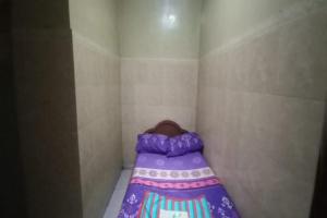 Voodi või voodid majutusasutuse OYO 94931 Mardi Homestay Syariah toas