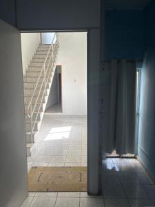 a view of a stairway with a glass door and stairs at Pousada São luis in Belém
