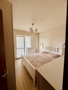 Ένα ή περισσότερα κρεβάτια σε δωμάτιο στο Apartament ultracentral Botanica